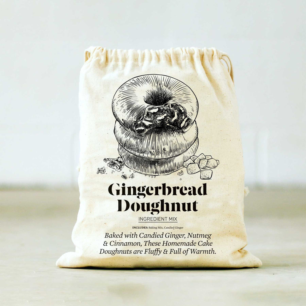 https://www.pineconetradingco.com/cdn/shop/products/gingerbread-doughnut-baking-mix-751893_1024x.jpg?v=1669182487